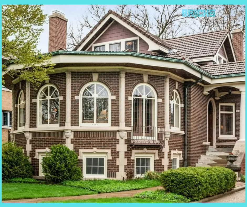A luxurious Chicago-style bungalow design with red brick walls and stairs leading to the patio.
