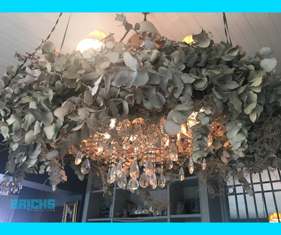 Make a chandelier with dry flowers to turn your simple bedroom into a cheerful and glamorous corner of your home