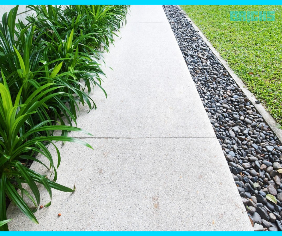 Pebbles on sidewalk garden decoration