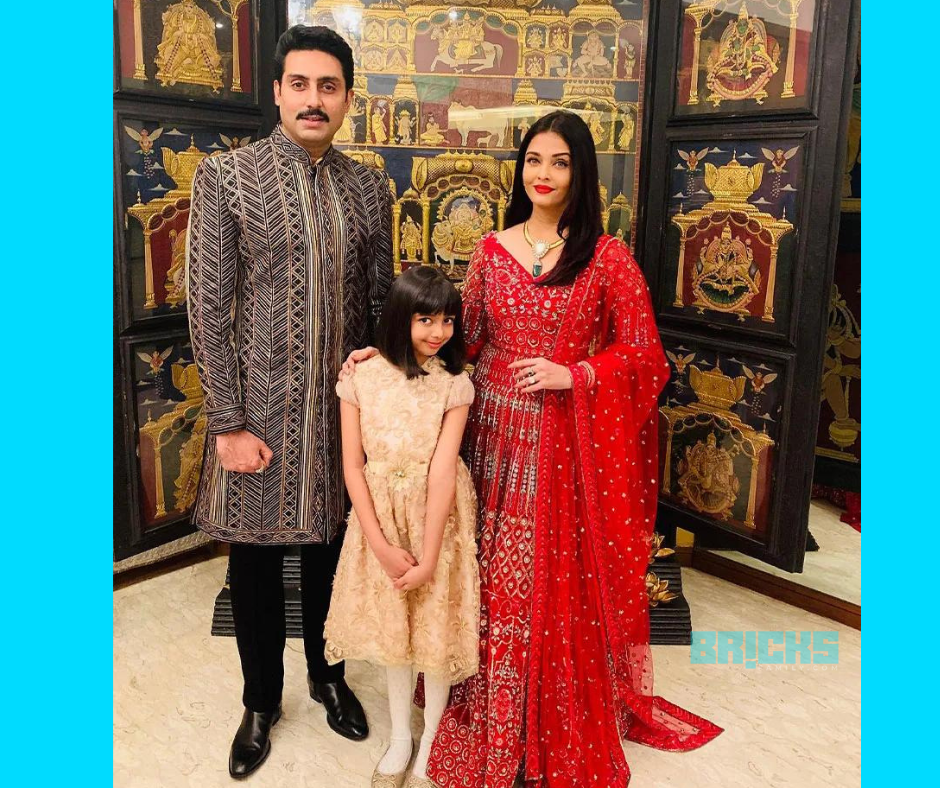 The Junior Bachchan family posing in their house before leaving for an event. 