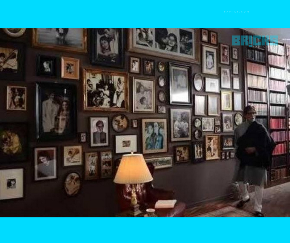 Amitabh Bacchan in his study with family frames