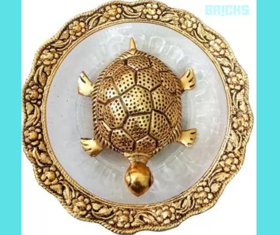 A metal tortoise placed a plate to bring wealth and prosperity.