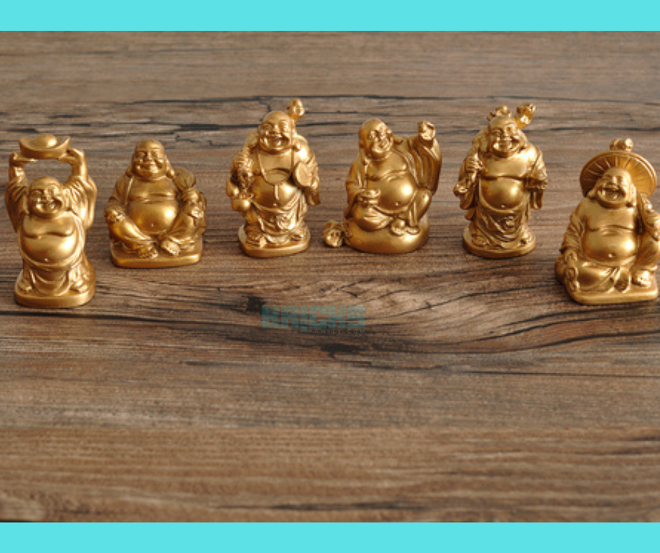 Laughing buddha figurines in different forms