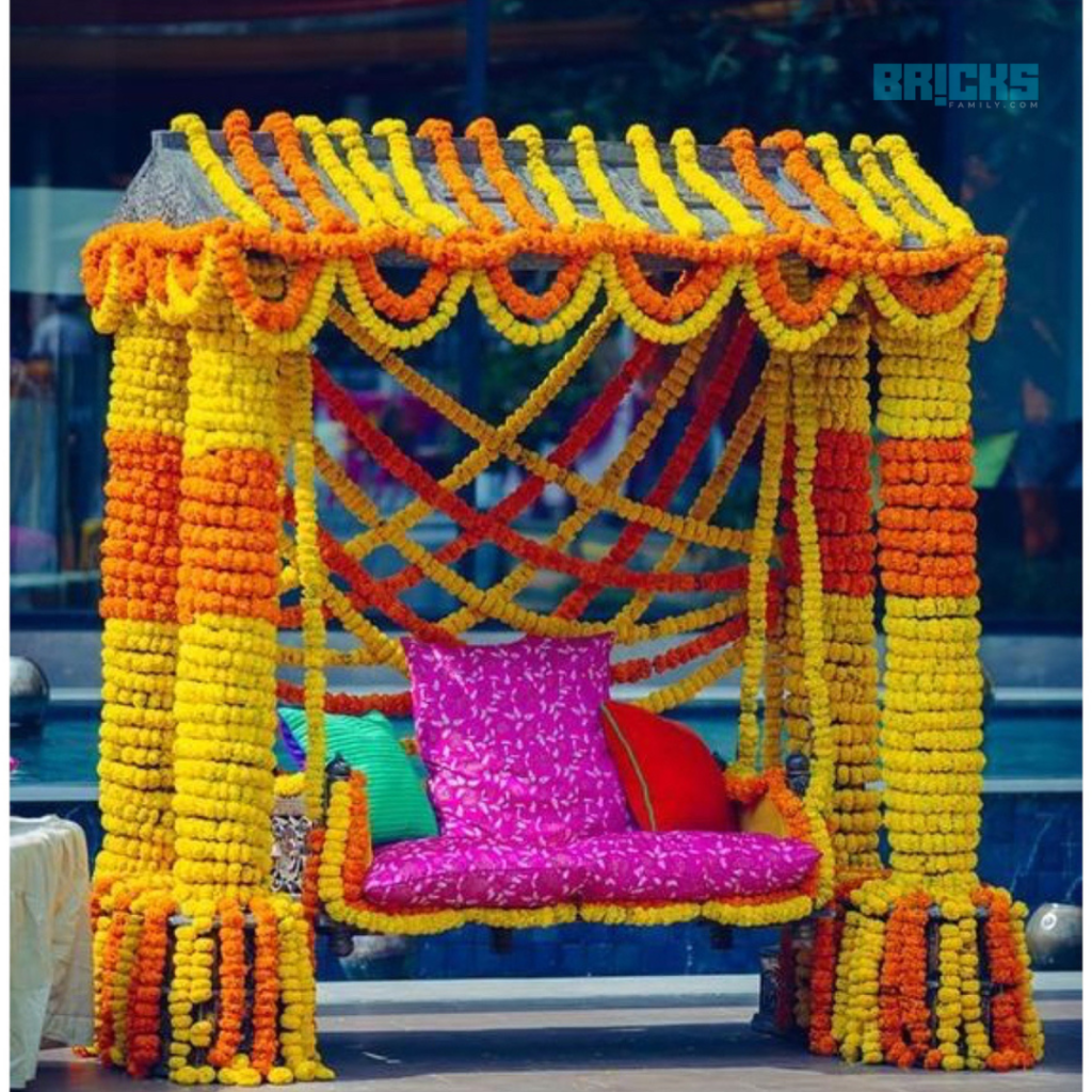 A swing in sync with haldi decorations for an at home ceremony