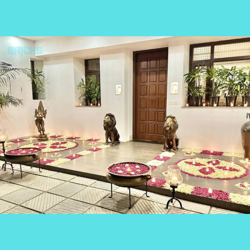 Entrance to the Raghav Chadha house decorated with flowers and diyas. 