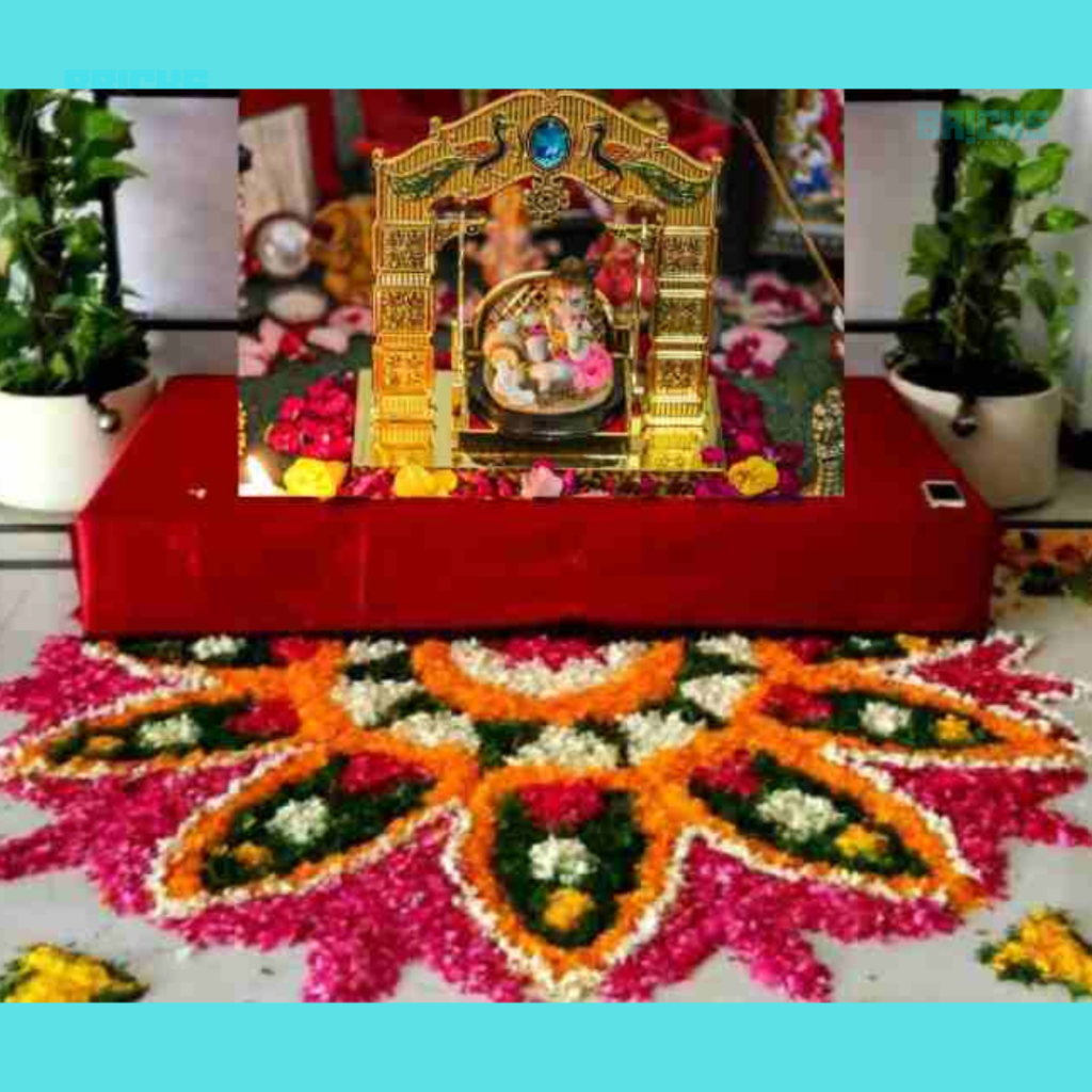 This cardboard stage augments the charm of this Radha Krishna idol