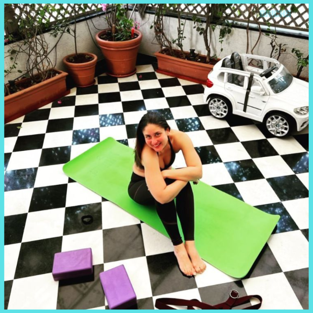 Kareena on a yoga mat in the outdoor patio area of the Kareena Kapoor house.