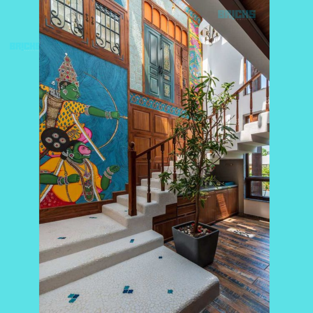 A modern duplex house design with artwork inspired by Hindu mythology. 