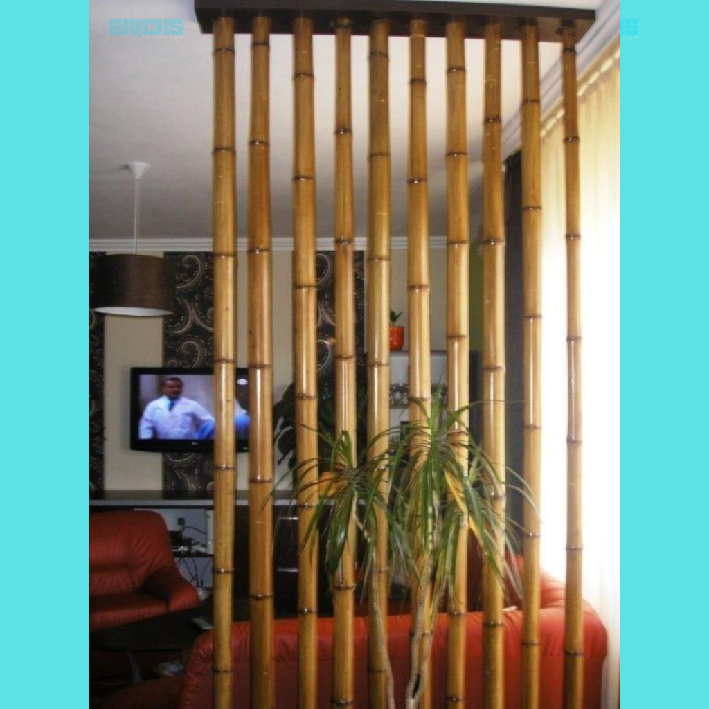 The rustic bamboo wall divider infuses a natural charm in this modern living room decor